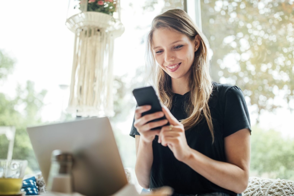 Woman on phone smiling