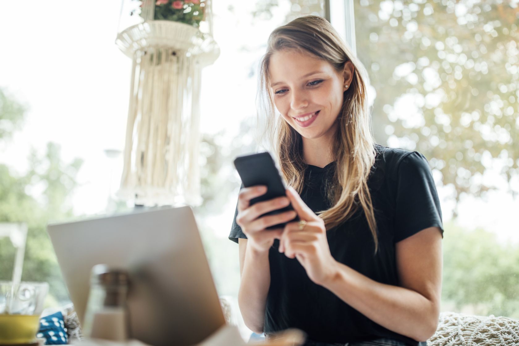 Woman on phone smiling
