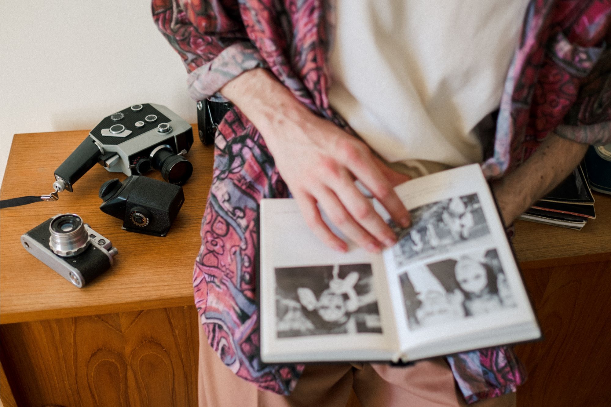 Man Looking Through Photo Album