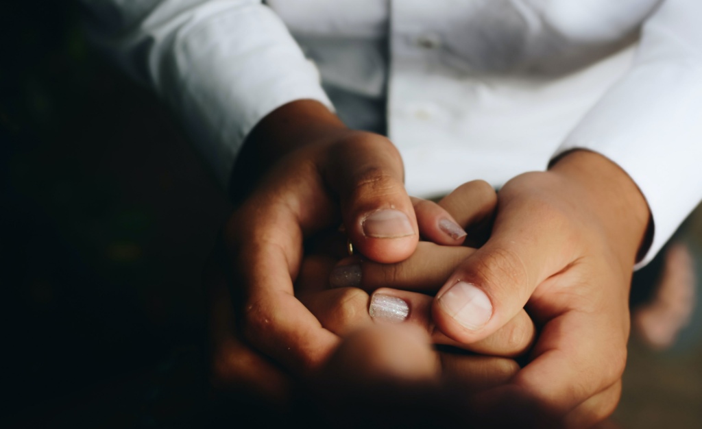 Two people holding hands