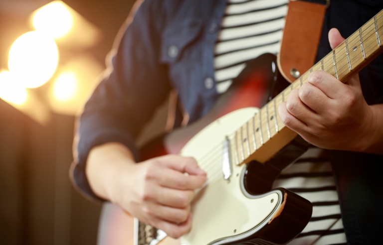 Playing electric guitar