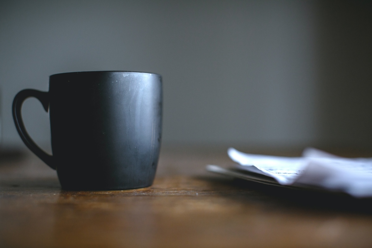 Mug next to papers