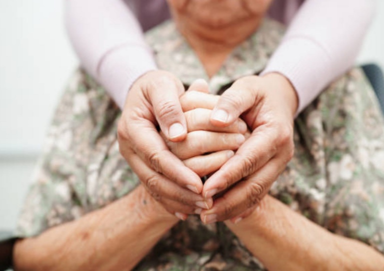 Hands held within hands